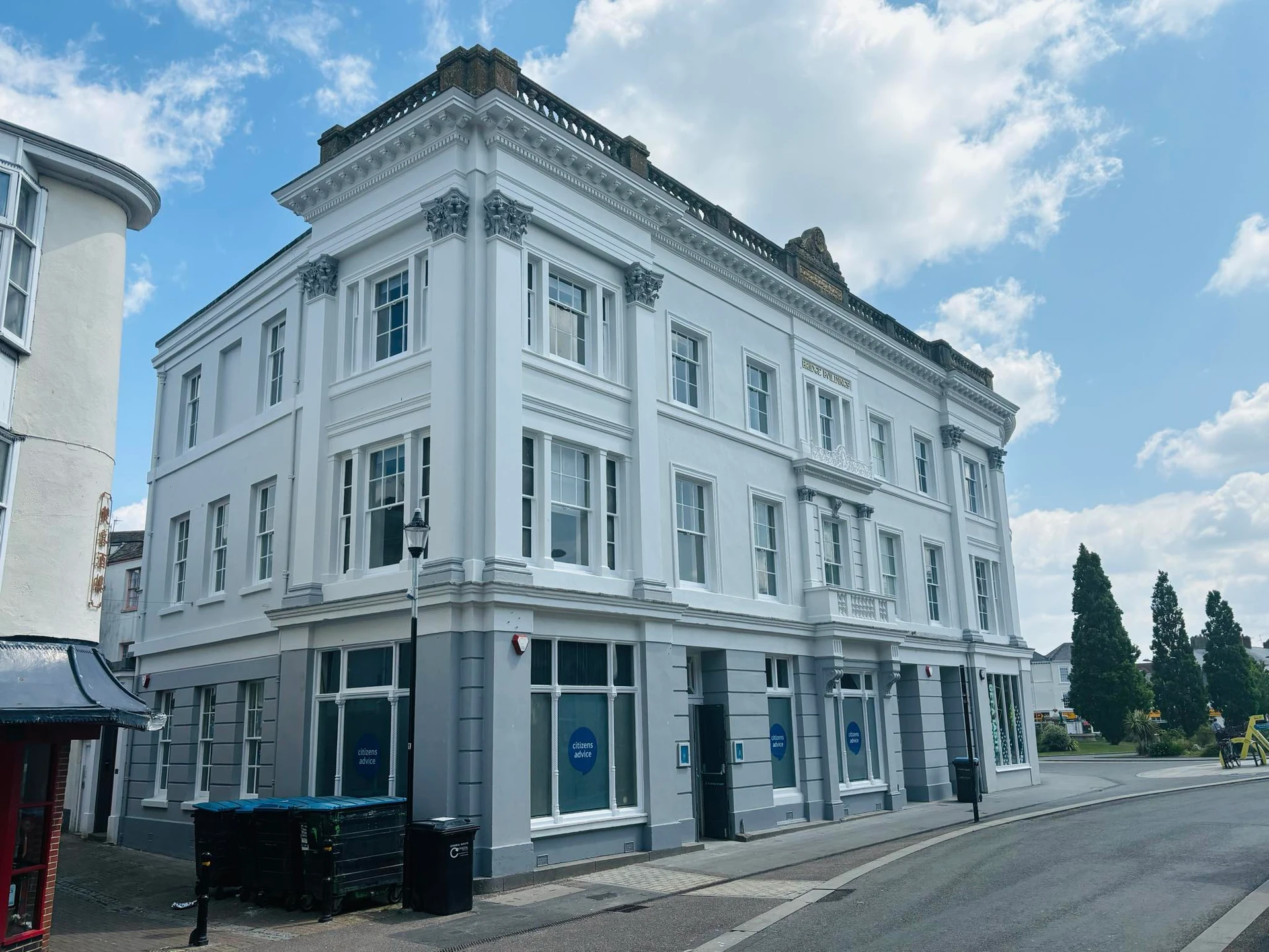 Corner view of Bridge Buildings showing the pristine white paint job and architectural details